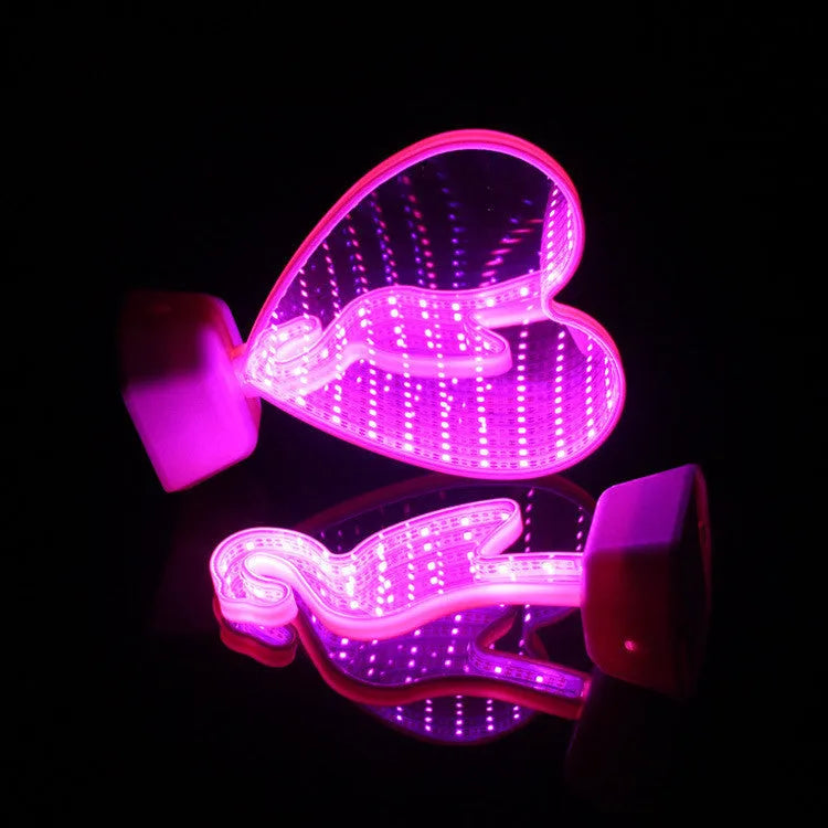 Rose red double-sided love tunnel shape LED decorative light on a flat surface.