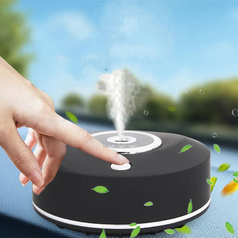 White plastic car aromatherapy diffuser with USB cable and anti-slip pad on a car dashboard.