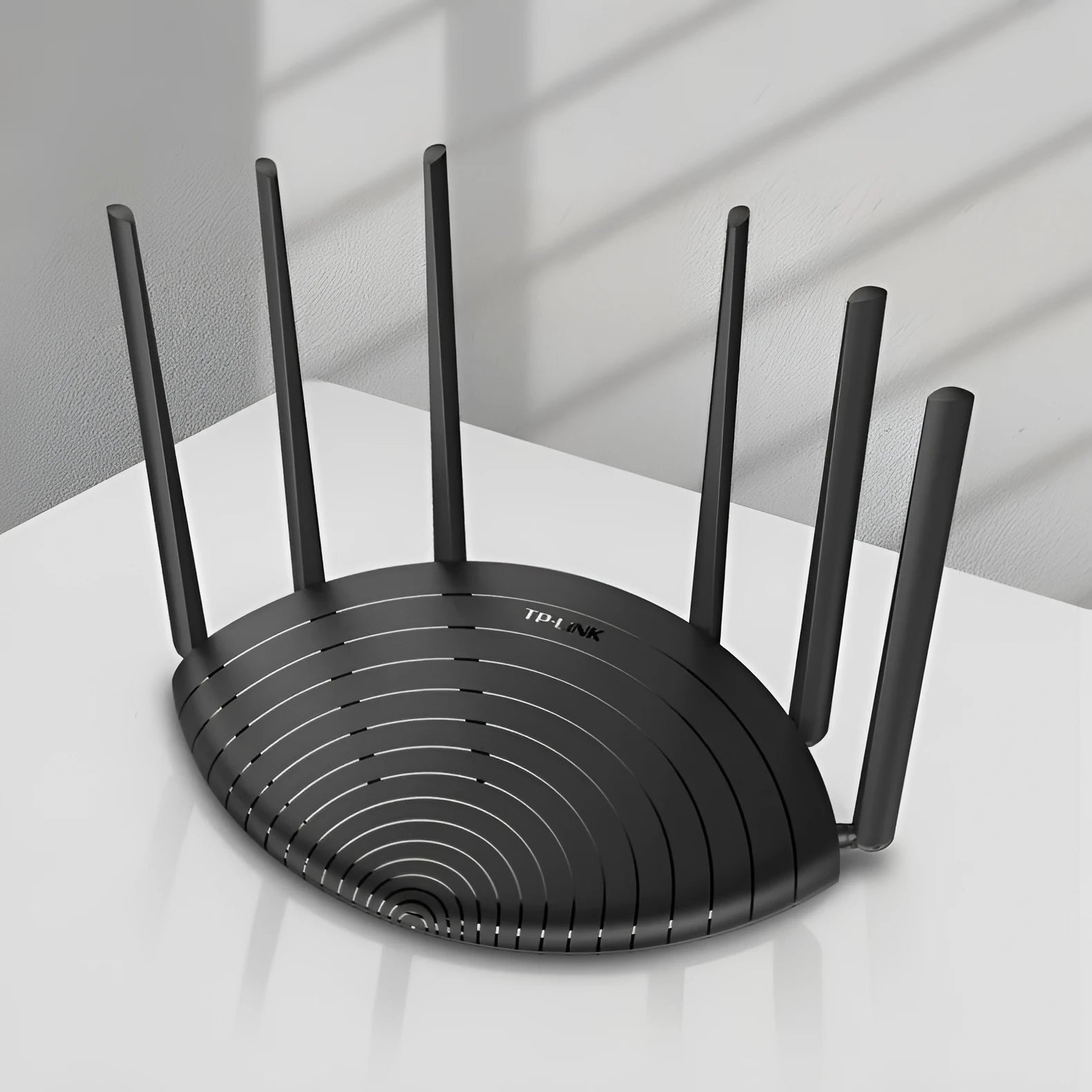 TP-Link TL-WDR7661 AC1900 Gigabit wireless router with compact black design and UK plug