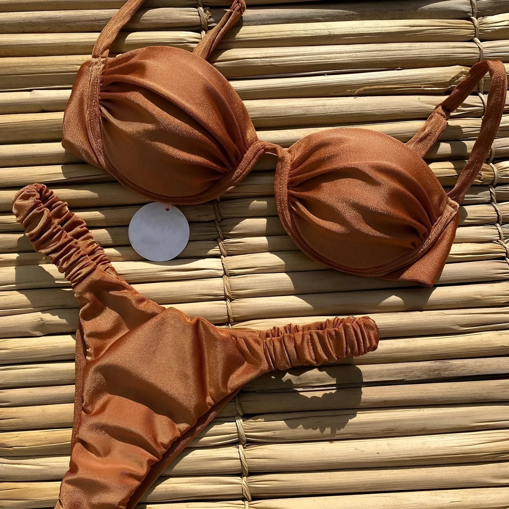 Women's khaki underwire bikini swimsuit with split bottom briefs on a mannequin.