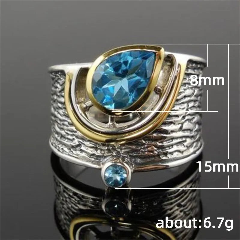 Blue Chinese style drop shape ring with rhinestone zircon inlay on alloy band showing women's jewellery
