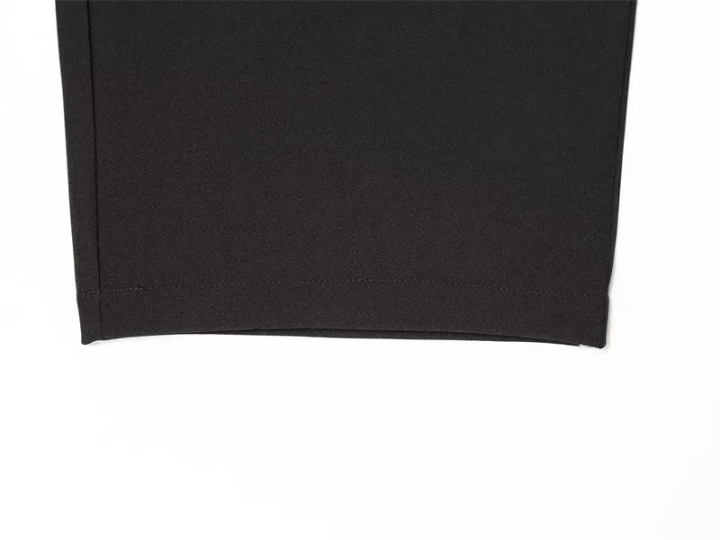 Women's black nylon high-waist zip-front straight-leg trousers on model
