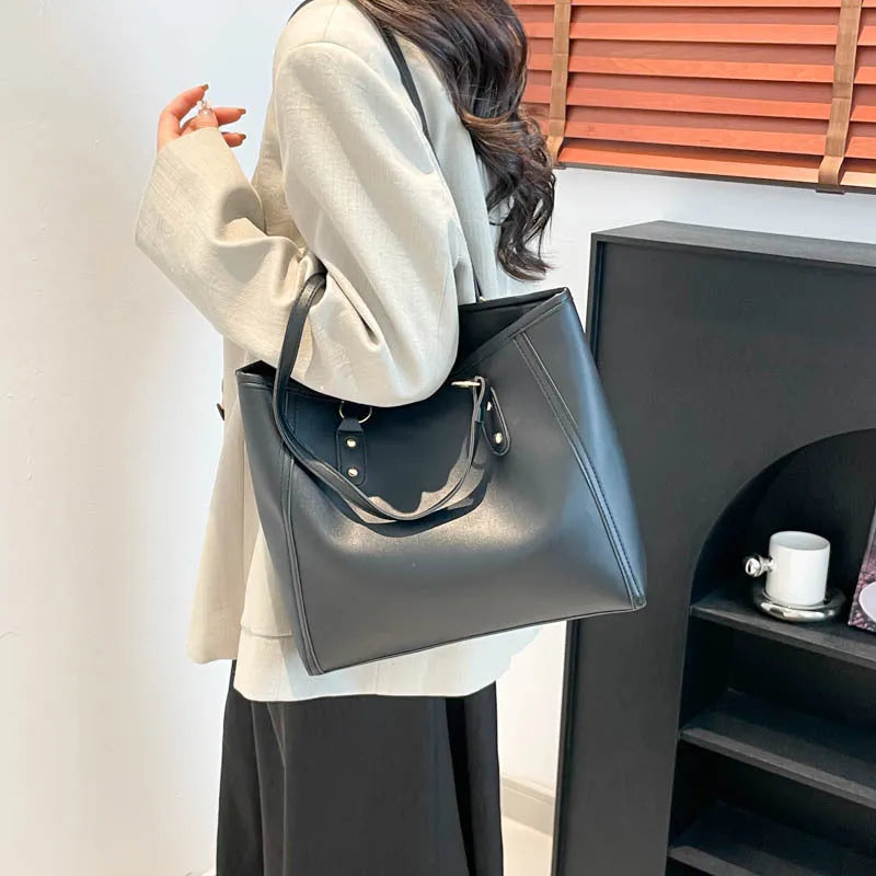 Korean style black PU shoulder underarm bag with a sandwich pocket and horizontal square shape.