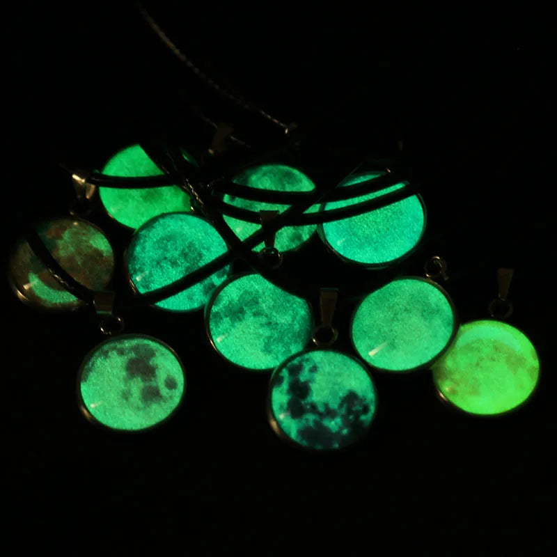 Luminous alloy necklace with a glass pendant depicting a Christmas moon night sky, showing the extension chain.
