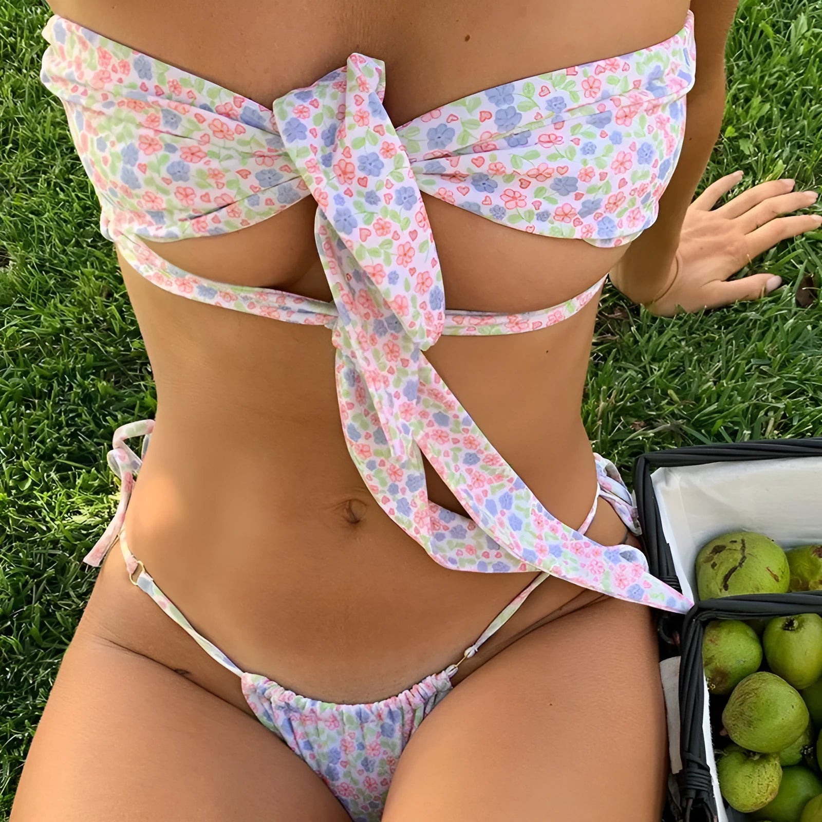 Women's lace-up front one-piece swimsuit with wireless chest pad in a floral print.