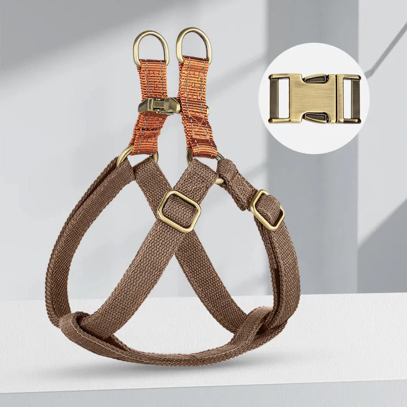 Brown vest-style dog leash harness made from cotton and nylon with metal clasp