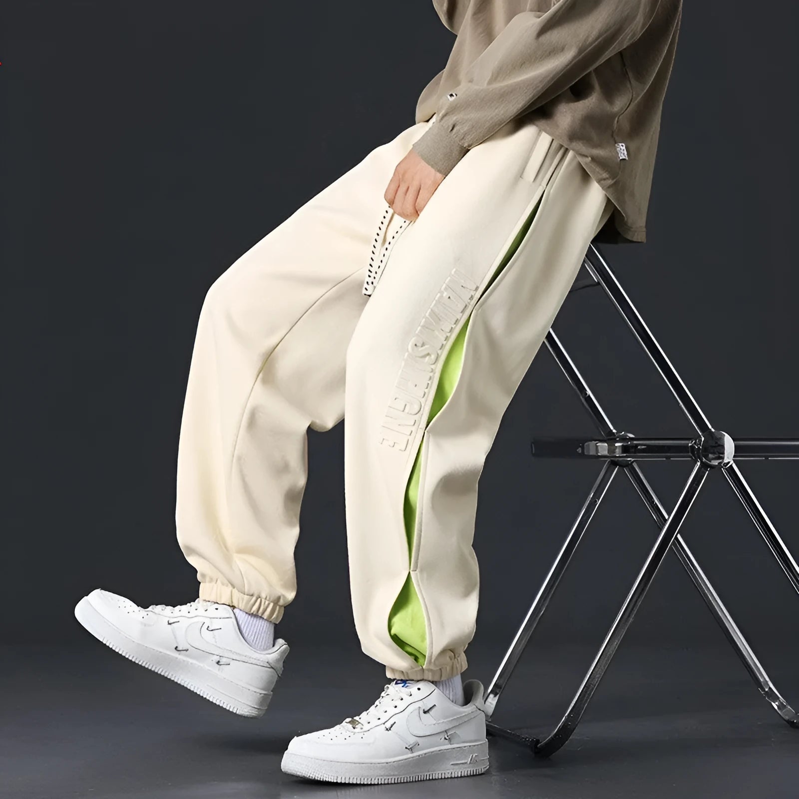 Men's black banded ankle cotton trousers with stitching detail and loose fit design