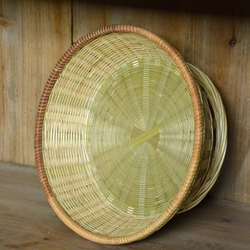 Handmade woven bamboo storage basket in natural colour showing three size variations