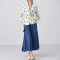 Women's floral print suit jacket with lace-up waist closure on a hanger.
