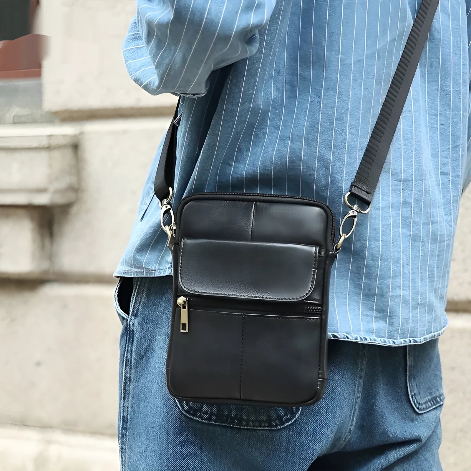 Men's brown genuine leather crossbody shoulder bag with sewing line detail.