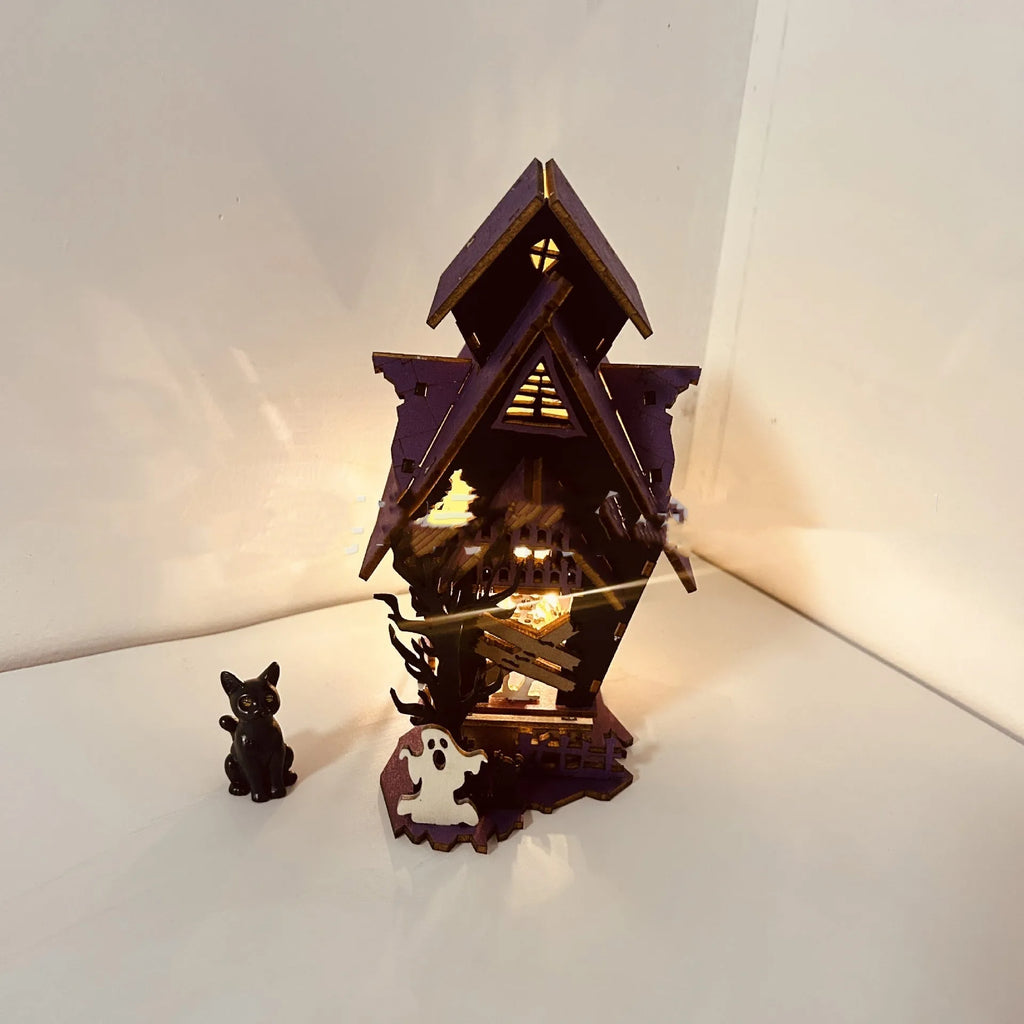 Wooden Halloween haunted house table decoration with luminous glowing design measuring 14 cm wide
