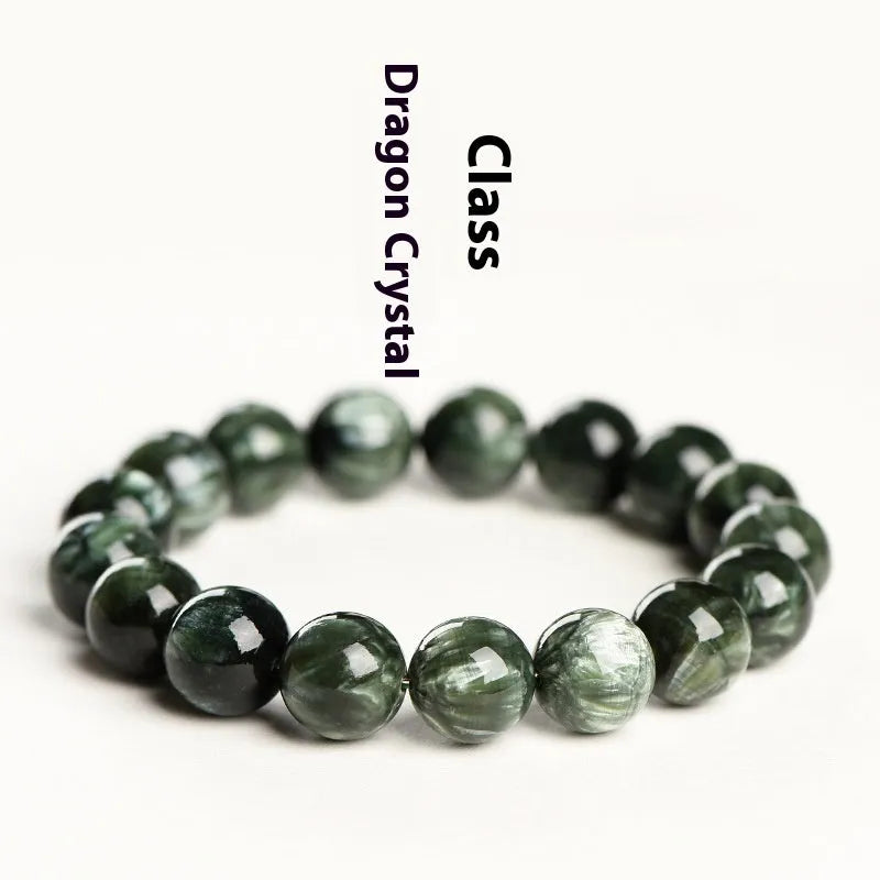 Green Dragon Crystal bracelet with 8-9mm round beads and Ruyi design elements on wrist