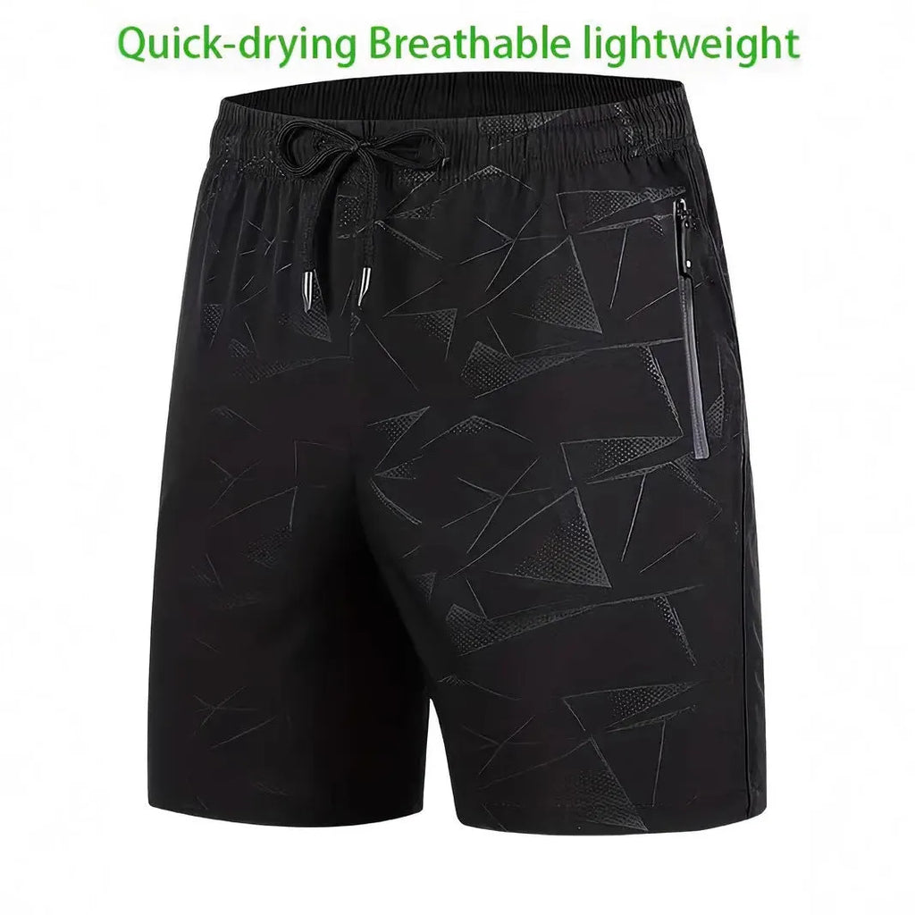 Man wearing loose fit grey polyester sports shorts with elastic waistband.