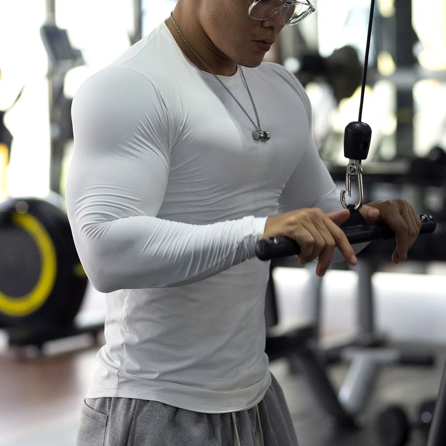 Men's black fitness tights with long sleeves and slim fit for running and gym workouts