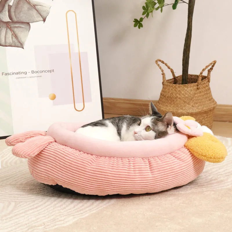 Pink semi-enclosed lobster pet nest with teddy fleece interior and non-slip base on a wood floor