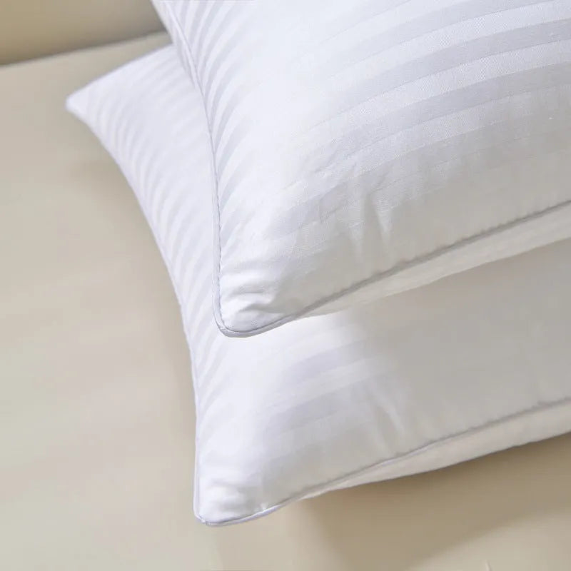 White cotton satin stripe pillow with feather cotton filler, shown in low, medium, and high loft options.