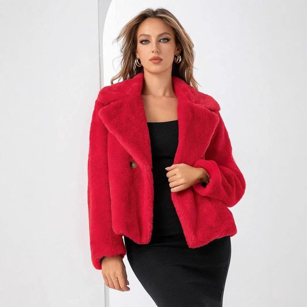 Women's rose red loose short faux fur coat with regular sleeves on a hanger.